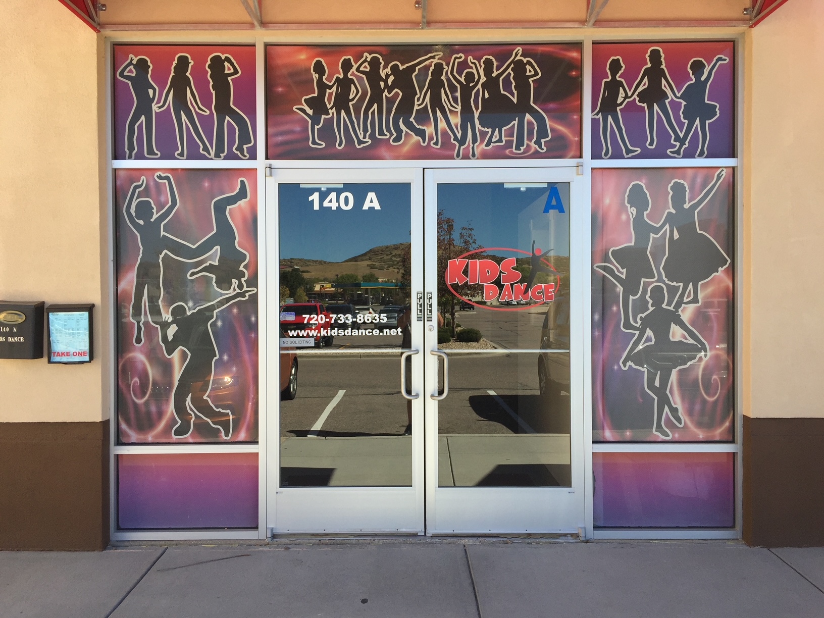 Custom commercial wall wrap installation by Big Dog Wraps in Castle Rock, CO